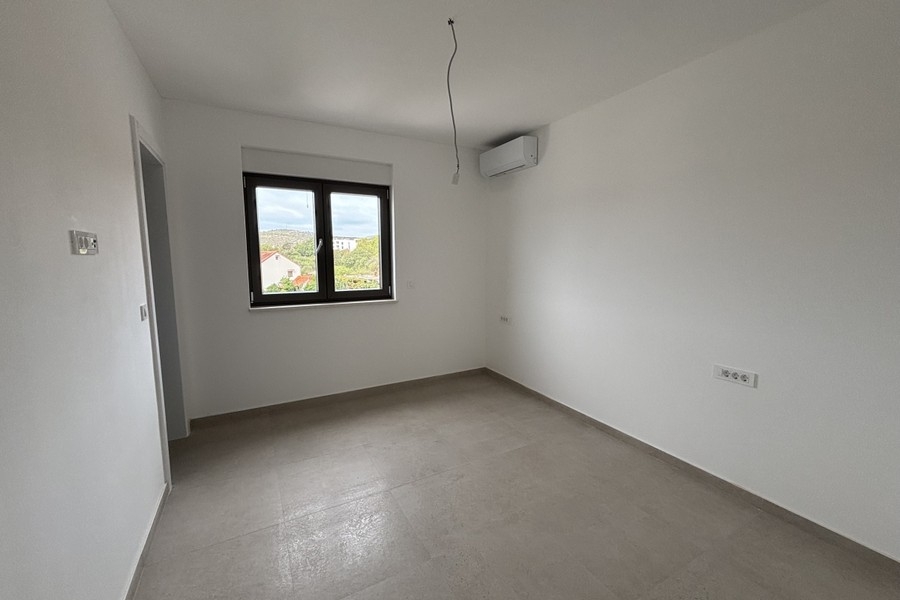 Bedroom with air conditioning unit and window