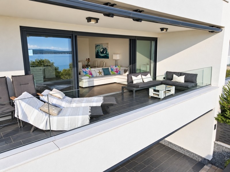 Terrace with sun loungers and lounge furniture