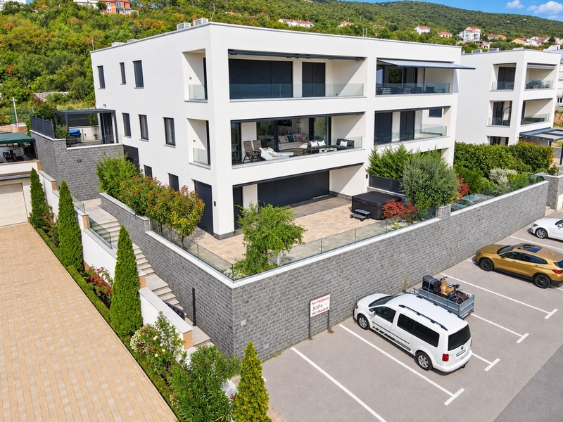 Residential building with gardens and parking spaces