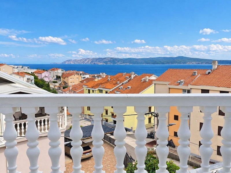 View over the balustrade of the terrace to the sea