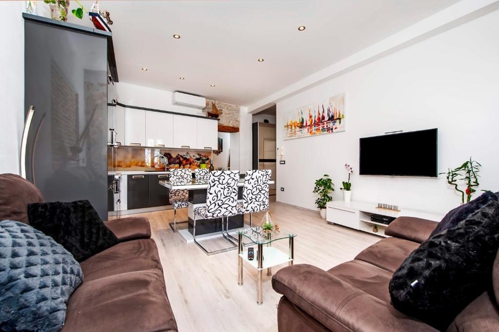 Living area with dining table and kitchen