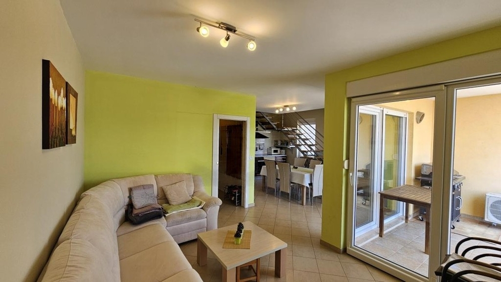 Living room with sofa and access to the balcony