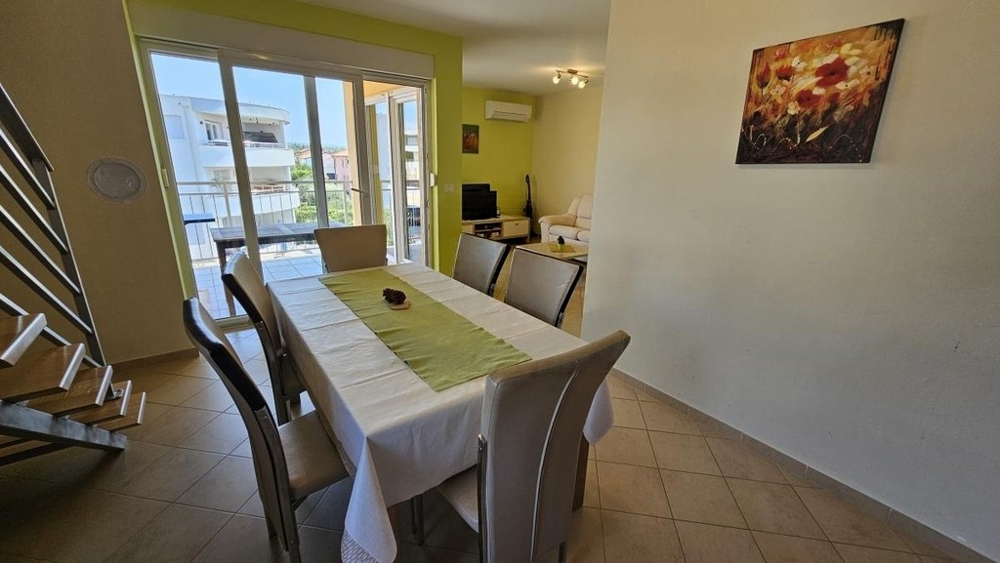Dining area with large table and view outside
