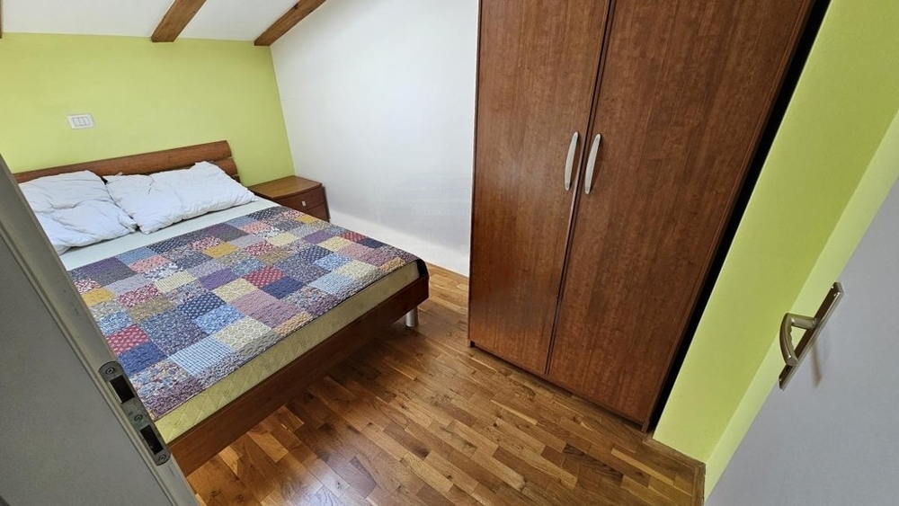 Bedroom with double bed and wardrobe