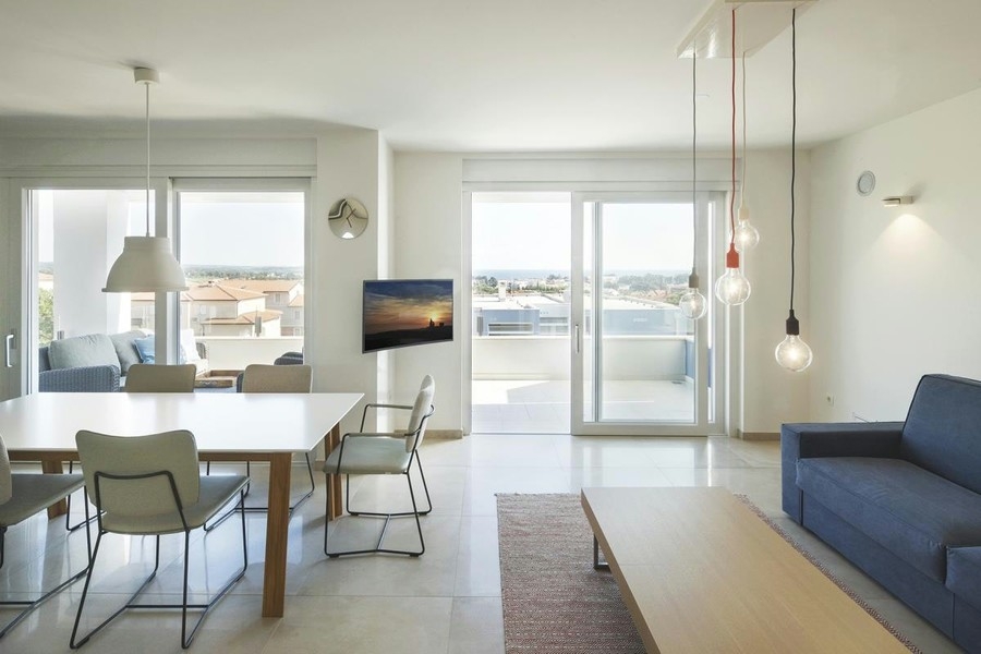 Bright living area with dining area and view of the terrace