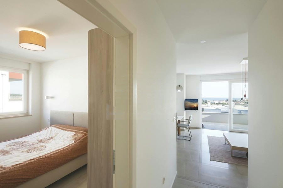 Second bedroom with a view of the living room