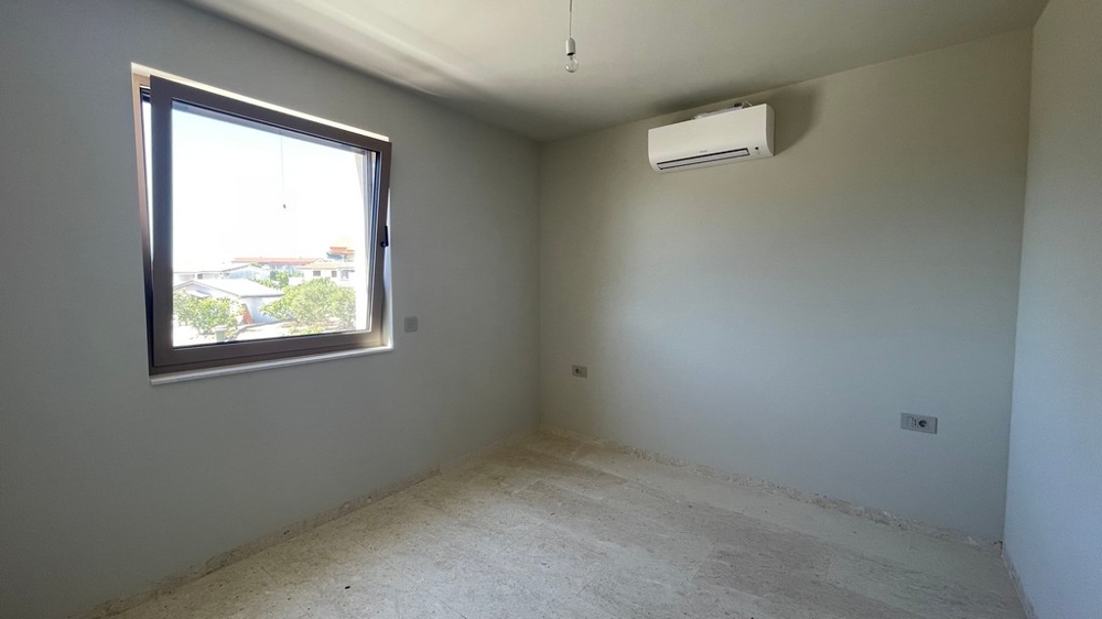Bedroom with window and air conditioning