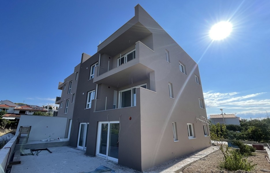 Exterior view of the new building with terraces and courtyard