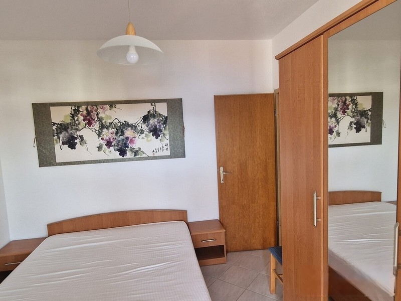 Bedroom with double bed and wardrobe