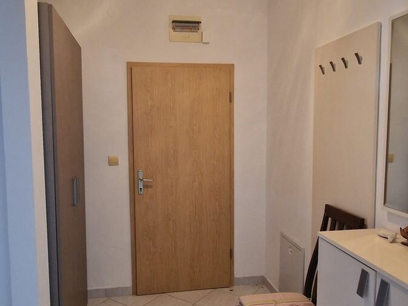 Hallway with entrance door and cloakroom