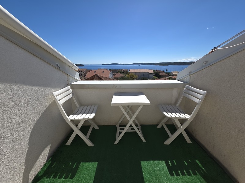 Terrace with seating and sea views