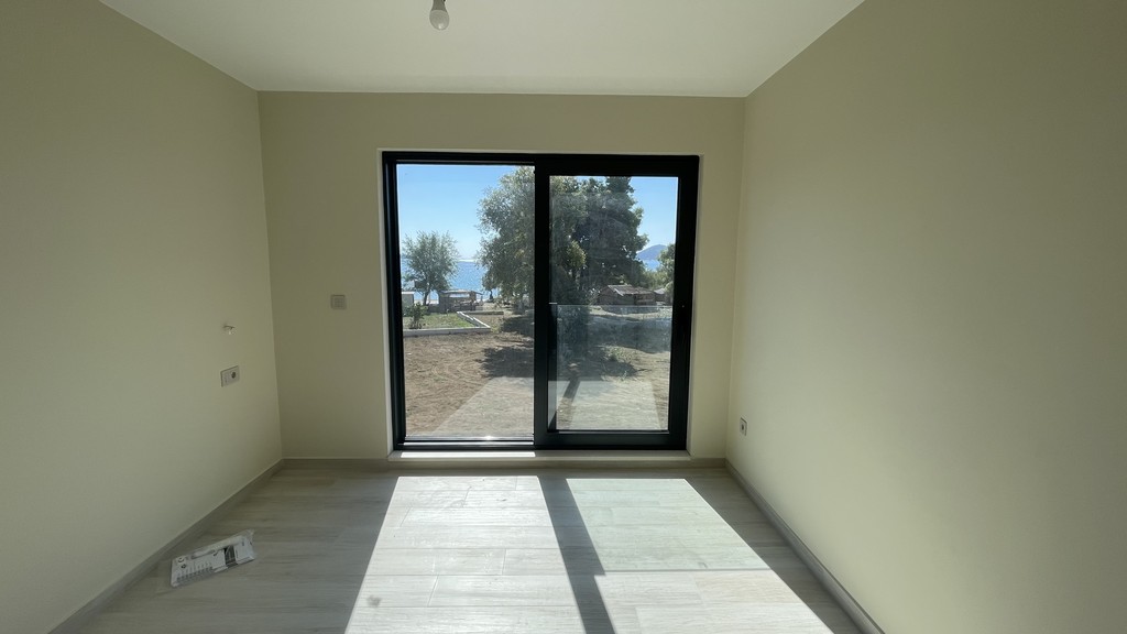 Bedroom with floor-to-ceiling window