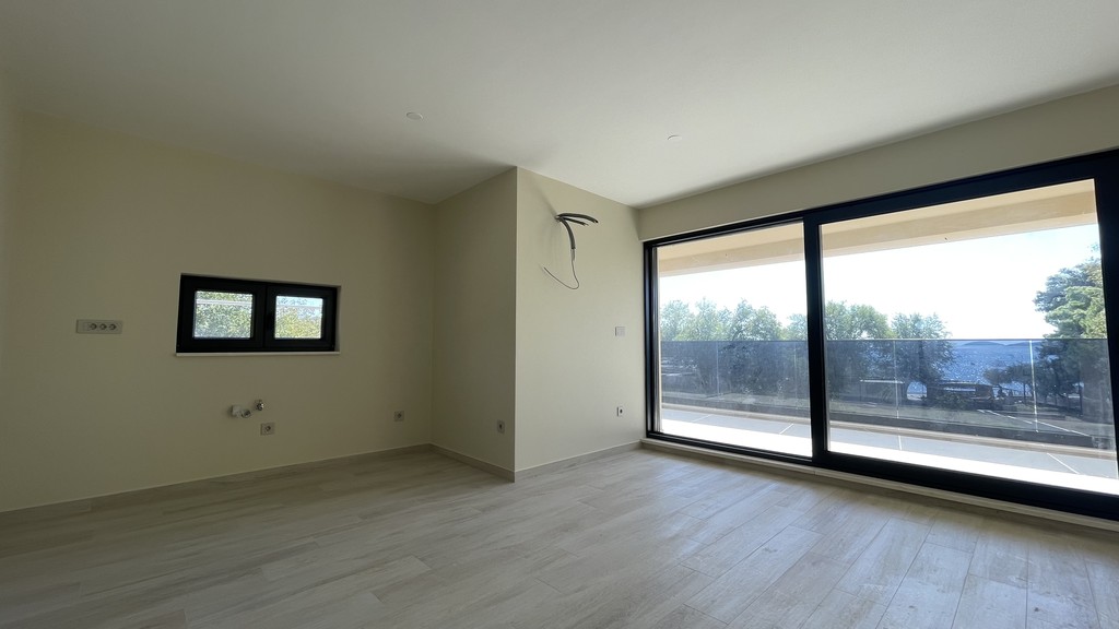 Kitchen area with window and patio door