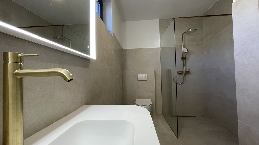 Bathroom with bathtub and shower