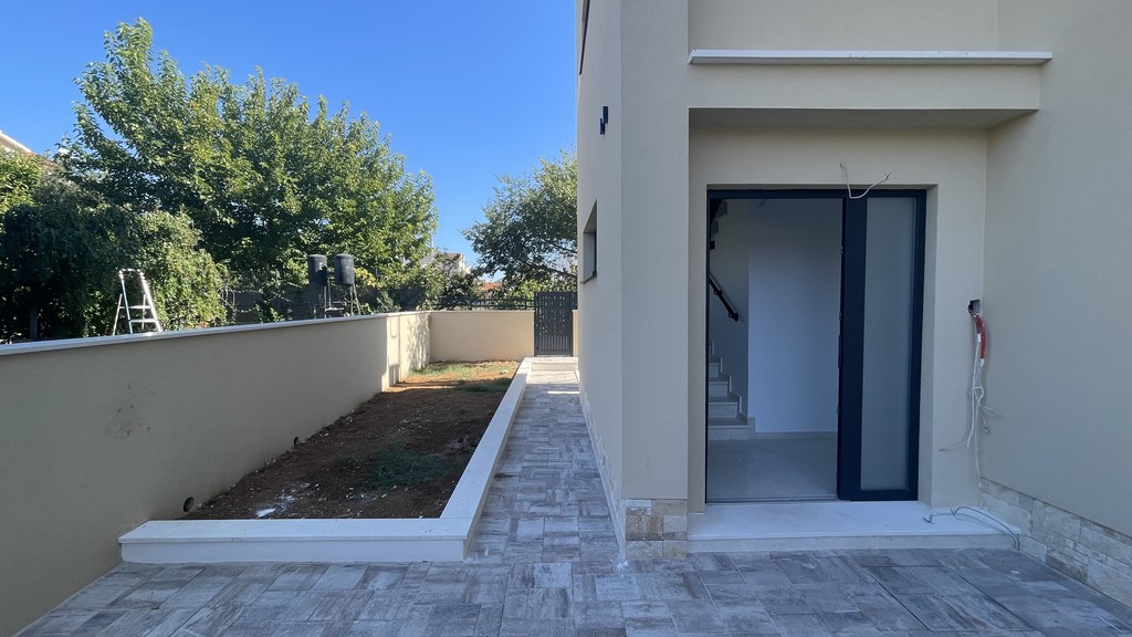 House entrance with paved path