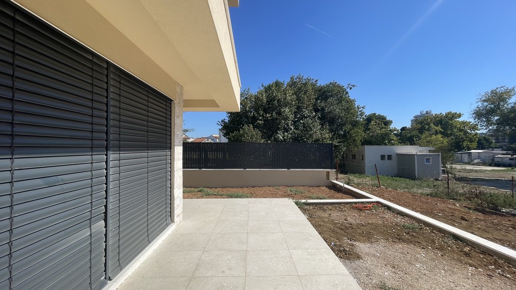 Terrace in front of the apartment with shutters