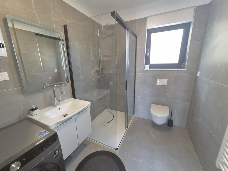 Sink and glass shower in the bathroom