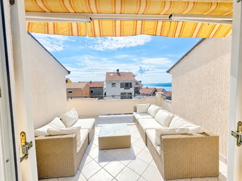 Terrace with sun sail and seating area