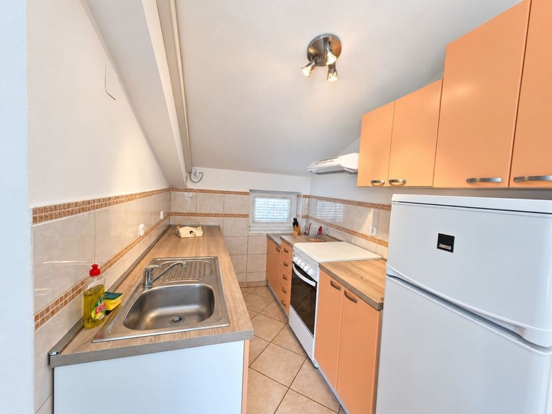 Kitchen with fridge and stove