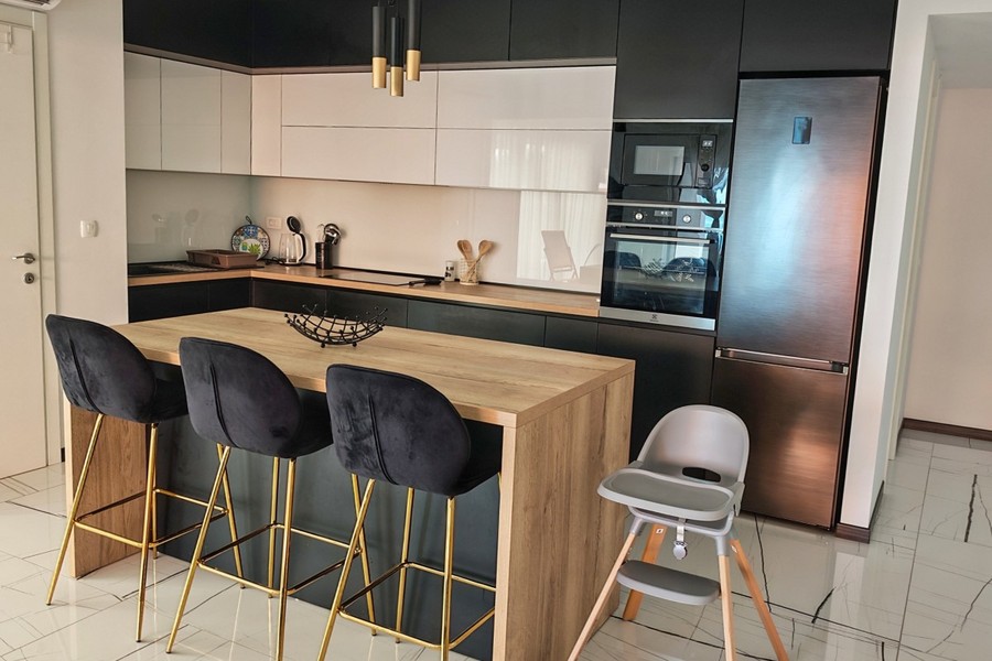 Kitchen with island and bar stools