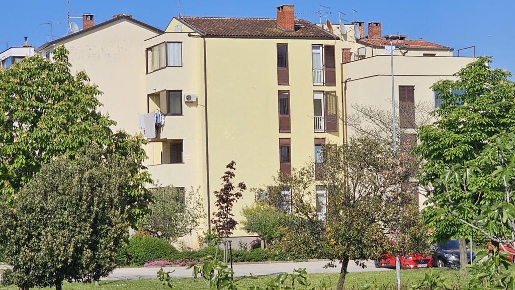 Exterior view of the residential building with garden