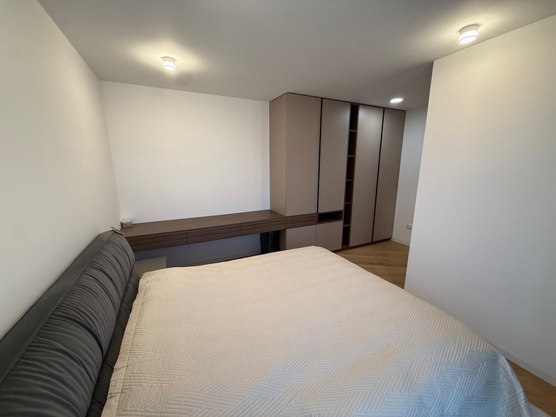 Bedroom with shelf and wardrobe