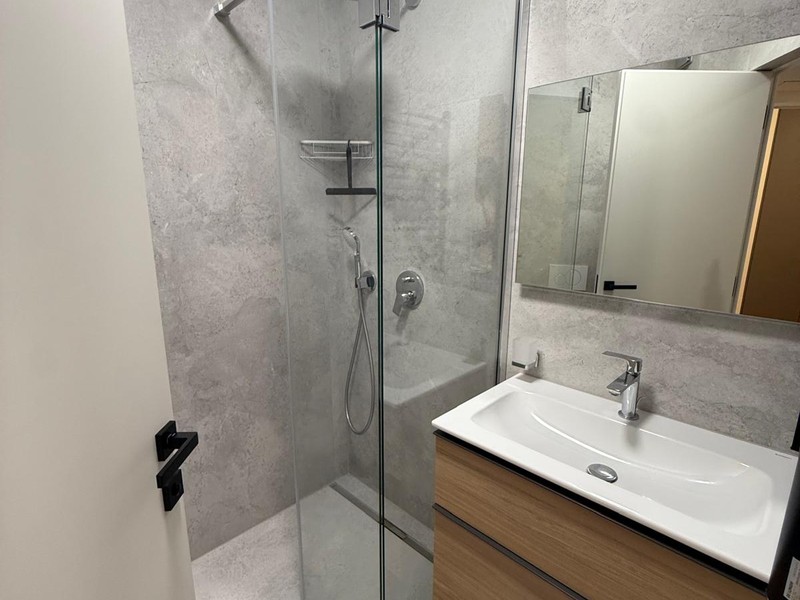 Shower room with wooden vanity unit