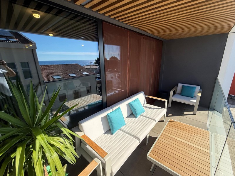 Partly covered terrace with lounge furniture
