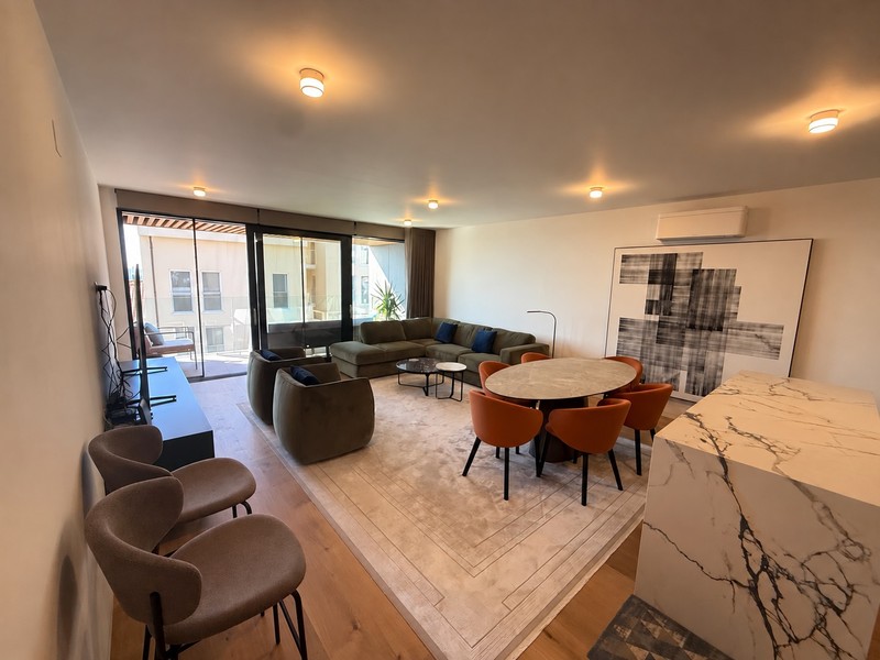 Open-plan living room with dining area and kitchen island