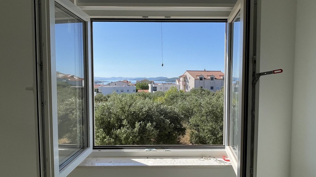 View of the sea from the open window