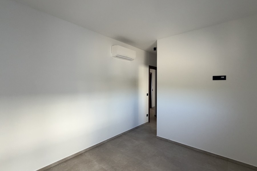 Room with air conditioning unit on the wall