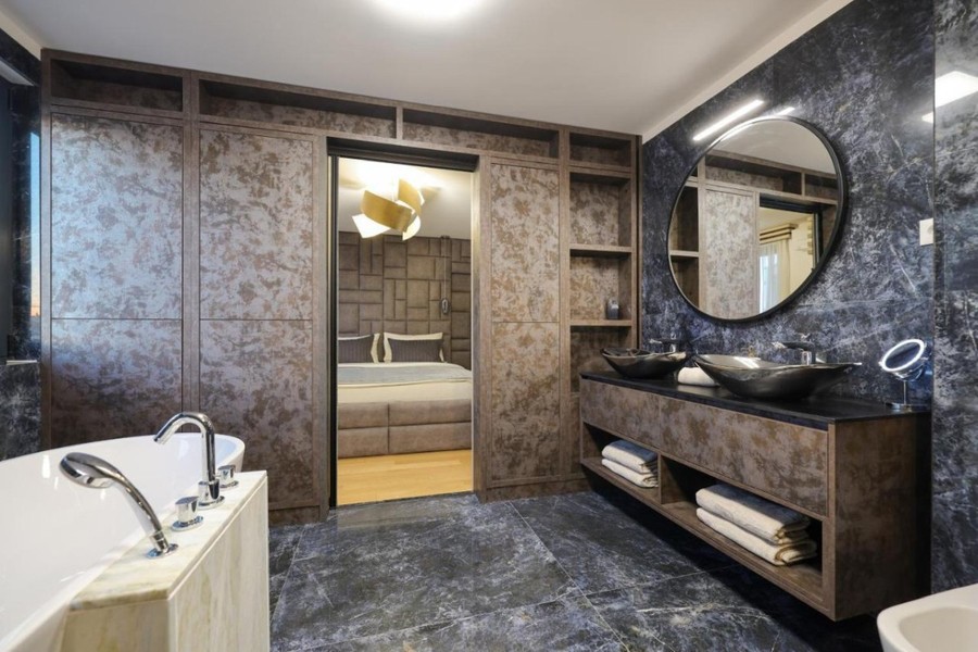 Bathroom with bath and double washbasin