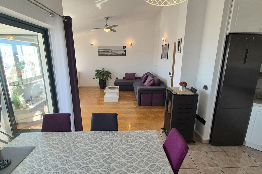 Living room with corner sofa and dining area