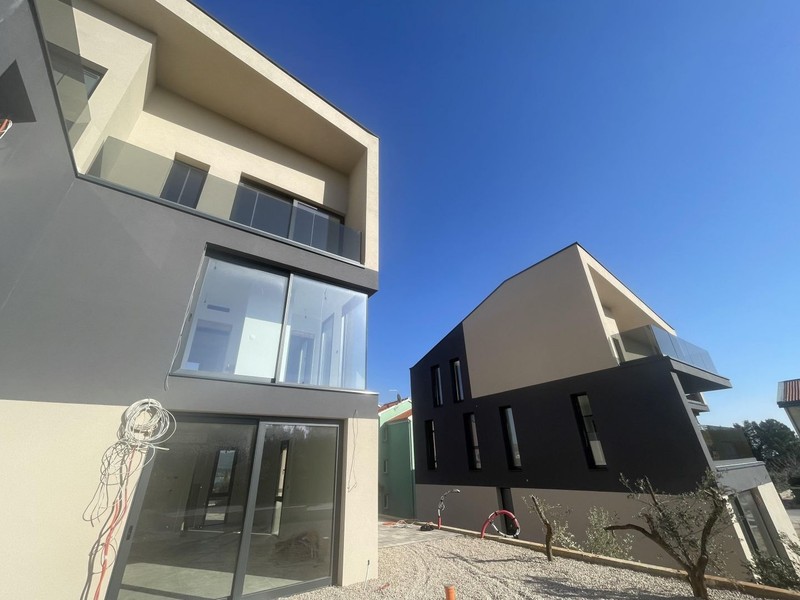 Facade with glass balconies and terraces