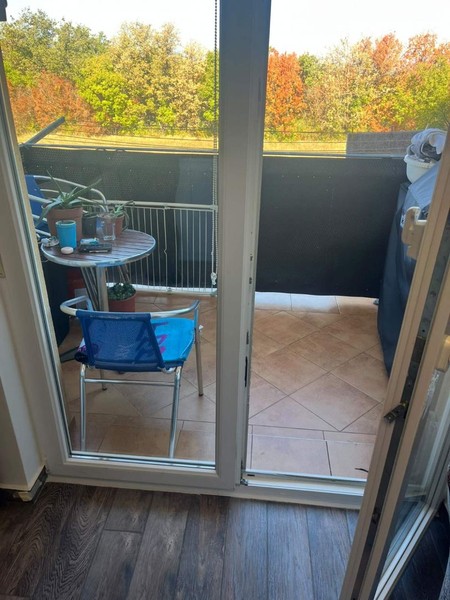 Balcony door with view of greenery