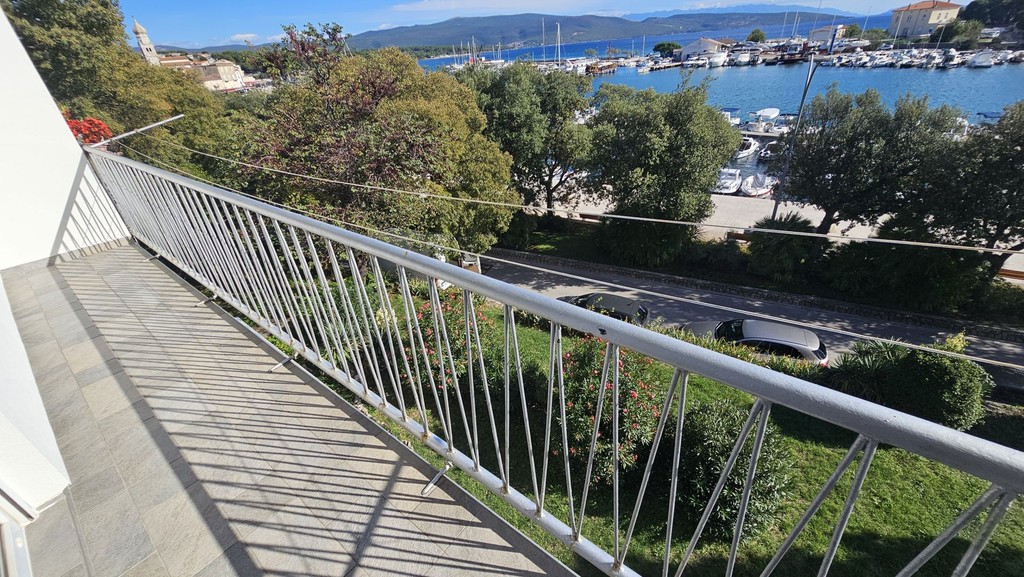 Long balcony with railing above the street