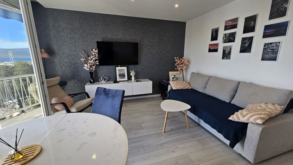 Living room with sofa and round dining table