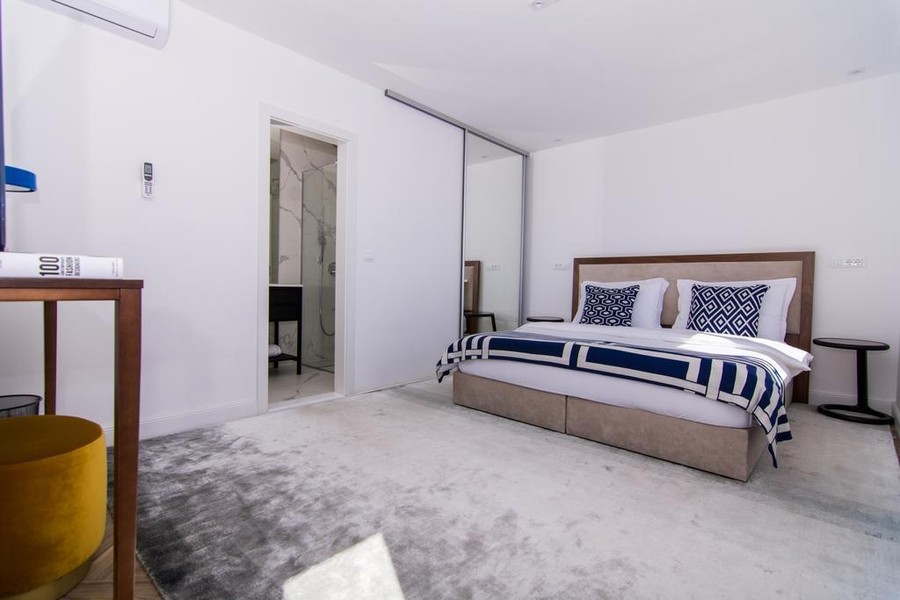Bedroom with built-in wardrobe and bathroom