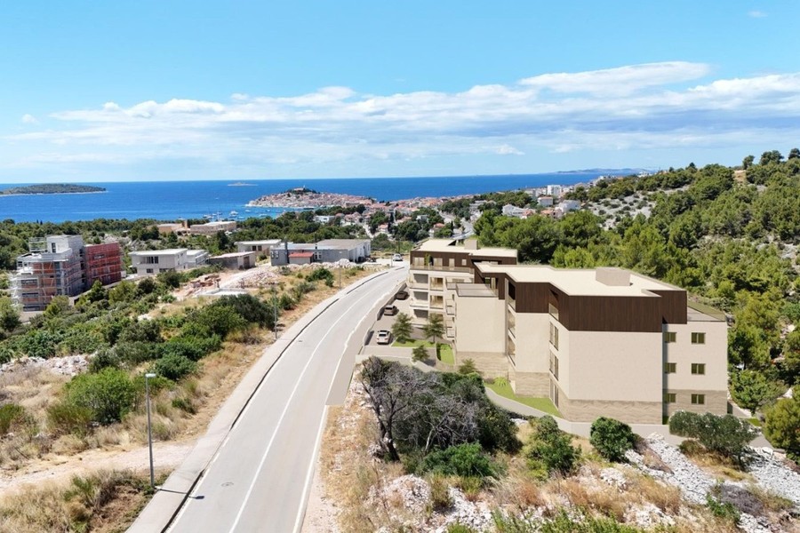 Visualisation: the building on the road above the village