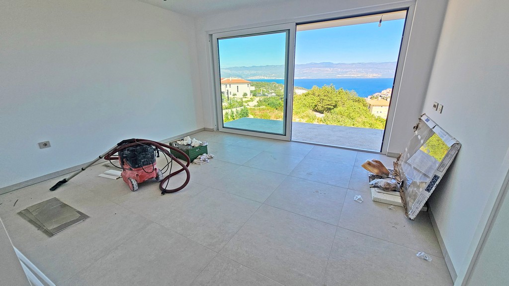 Living room with sliding door and sea view