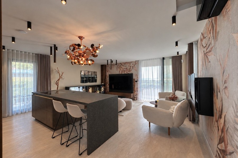 Kitchen island with bar stools and chandelier