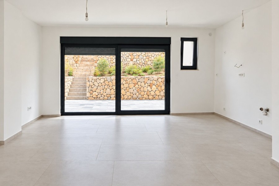 Living room with glass door to the terrace