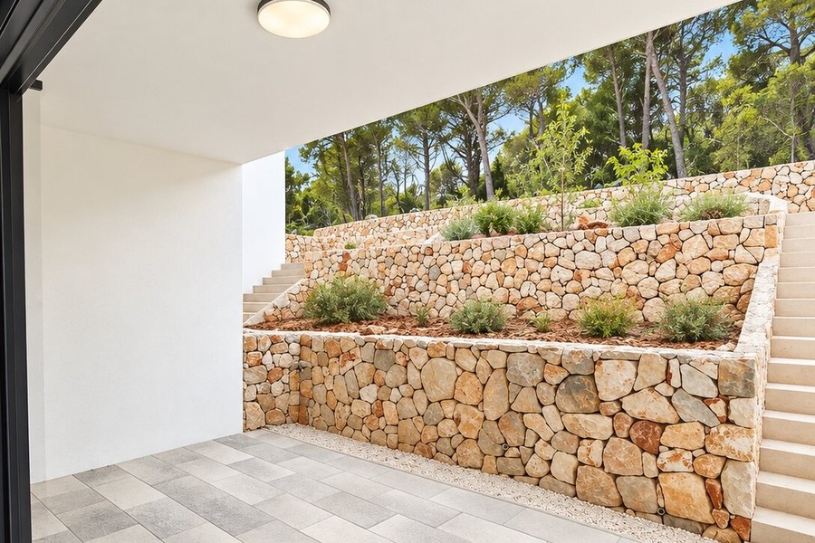 Garden with natural stone walls and plants