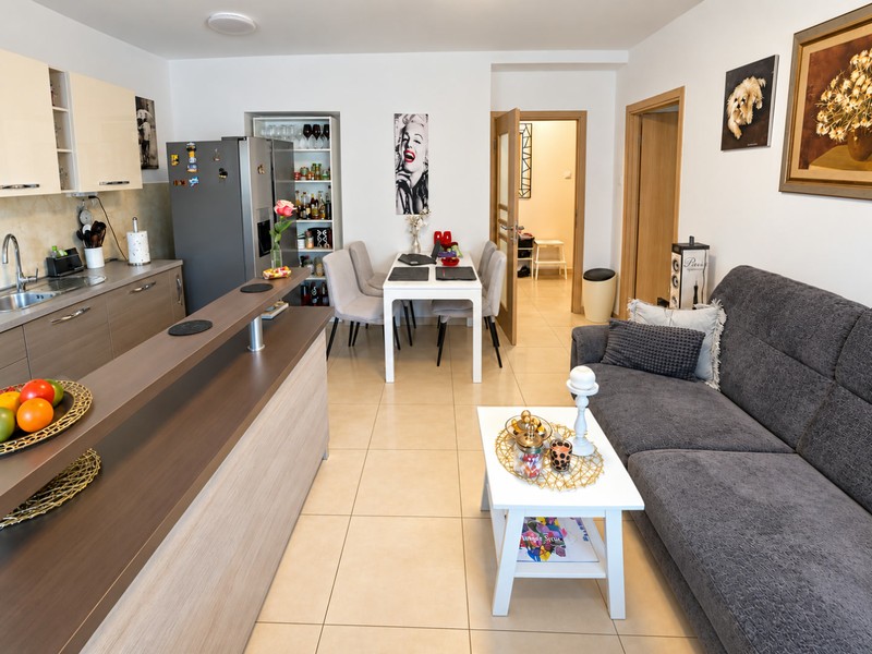 Living area with view into the kitchen