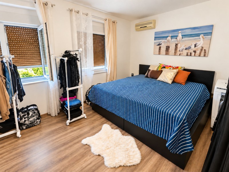 Bedroom with double bed and air conditioning