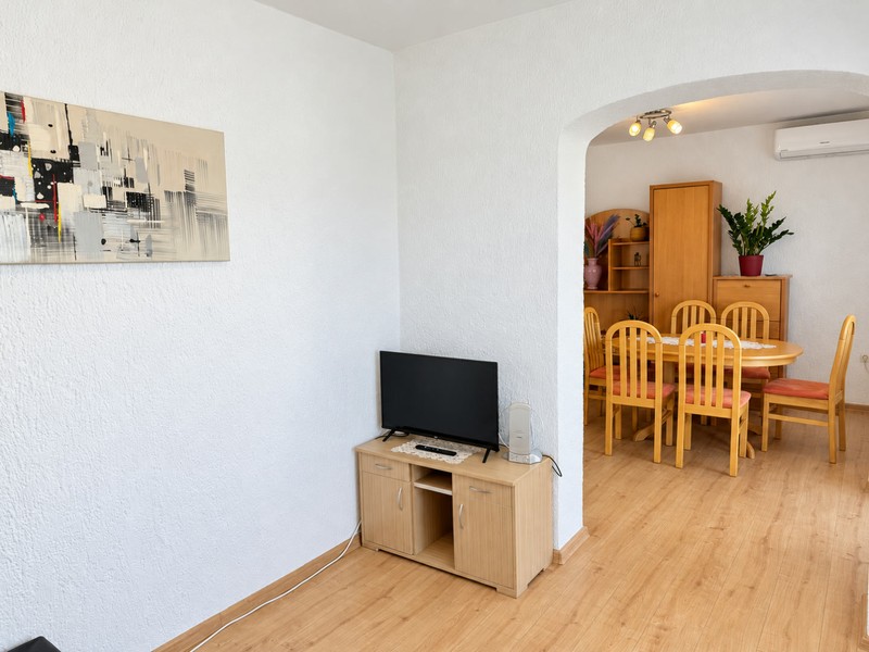 Living room with television and dining table