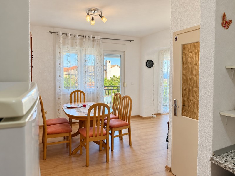 Dining area with door to kitchen