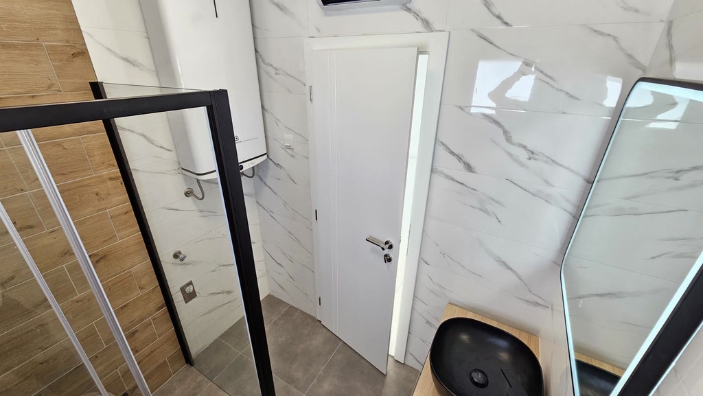 Shower area with glass wall