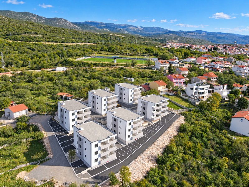Residential complex with mountains in the background