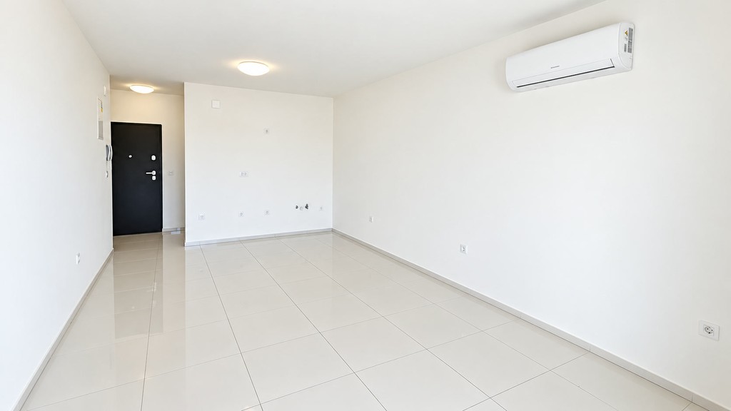 Bright living room with air conditioning unit